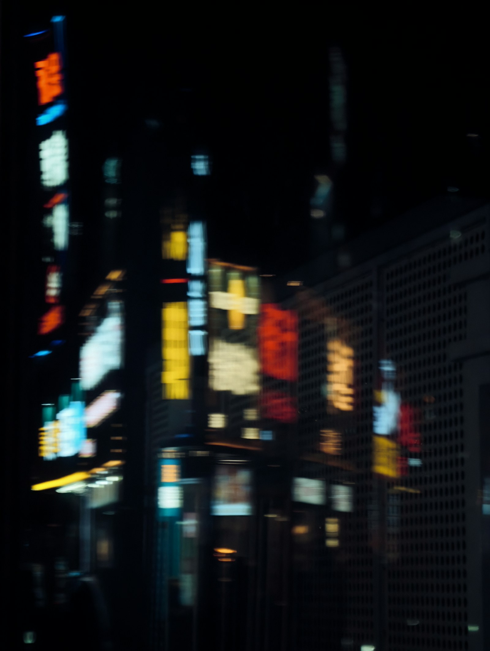Abstract neon signs on a dark city street