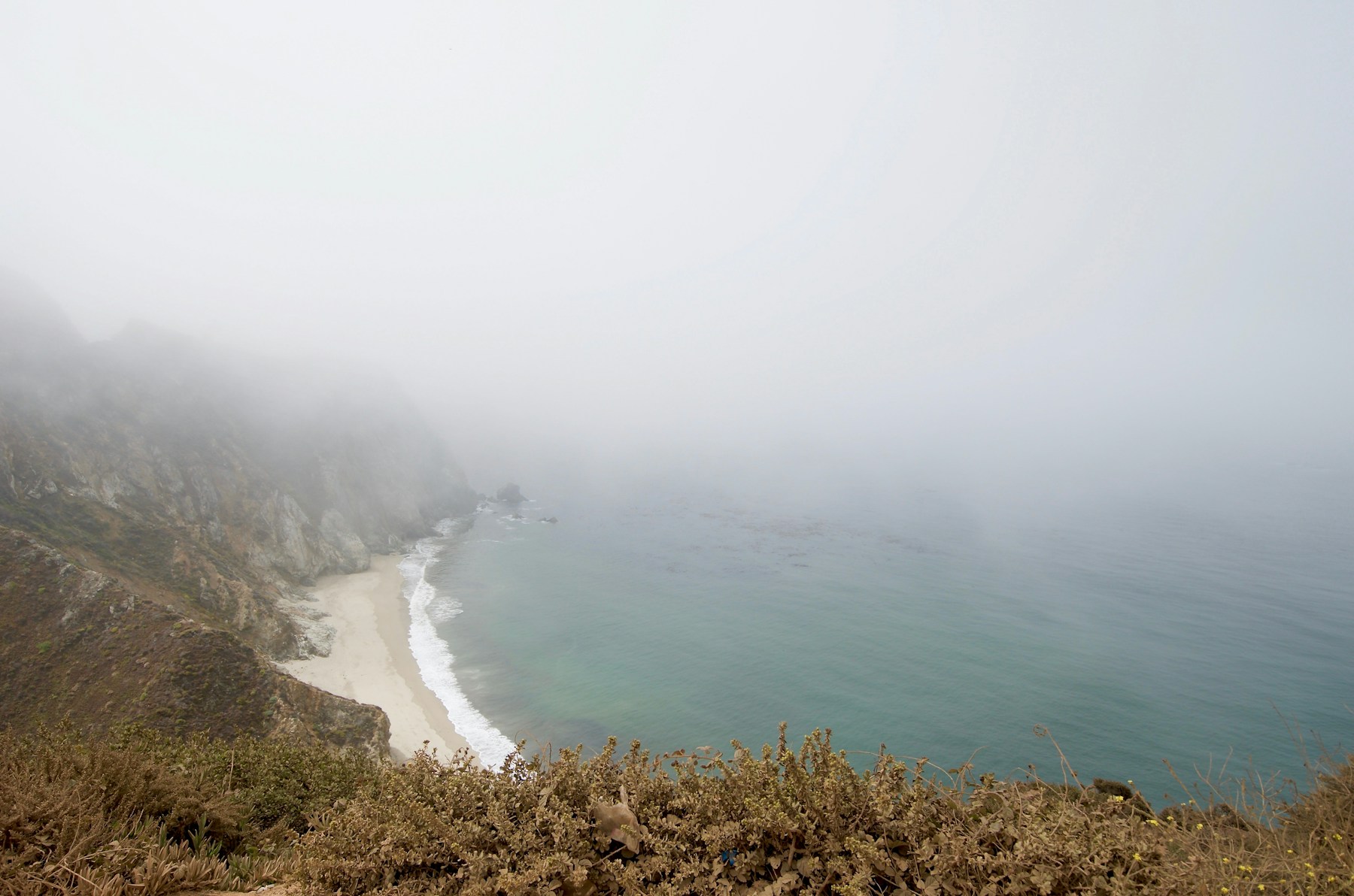 Misty Big Sur coastline with ocean waves