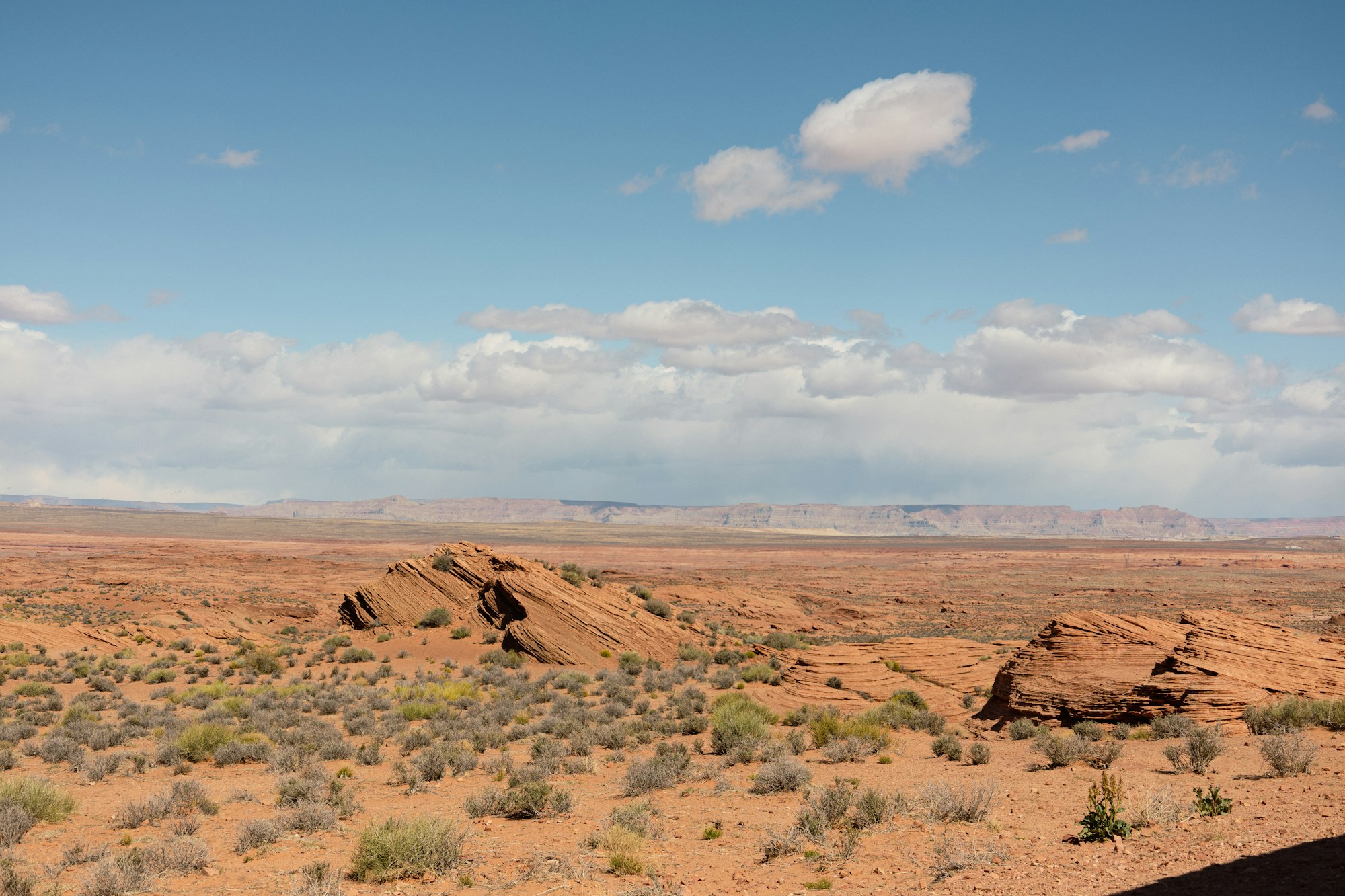 Desert rock formations under a cloudy sky